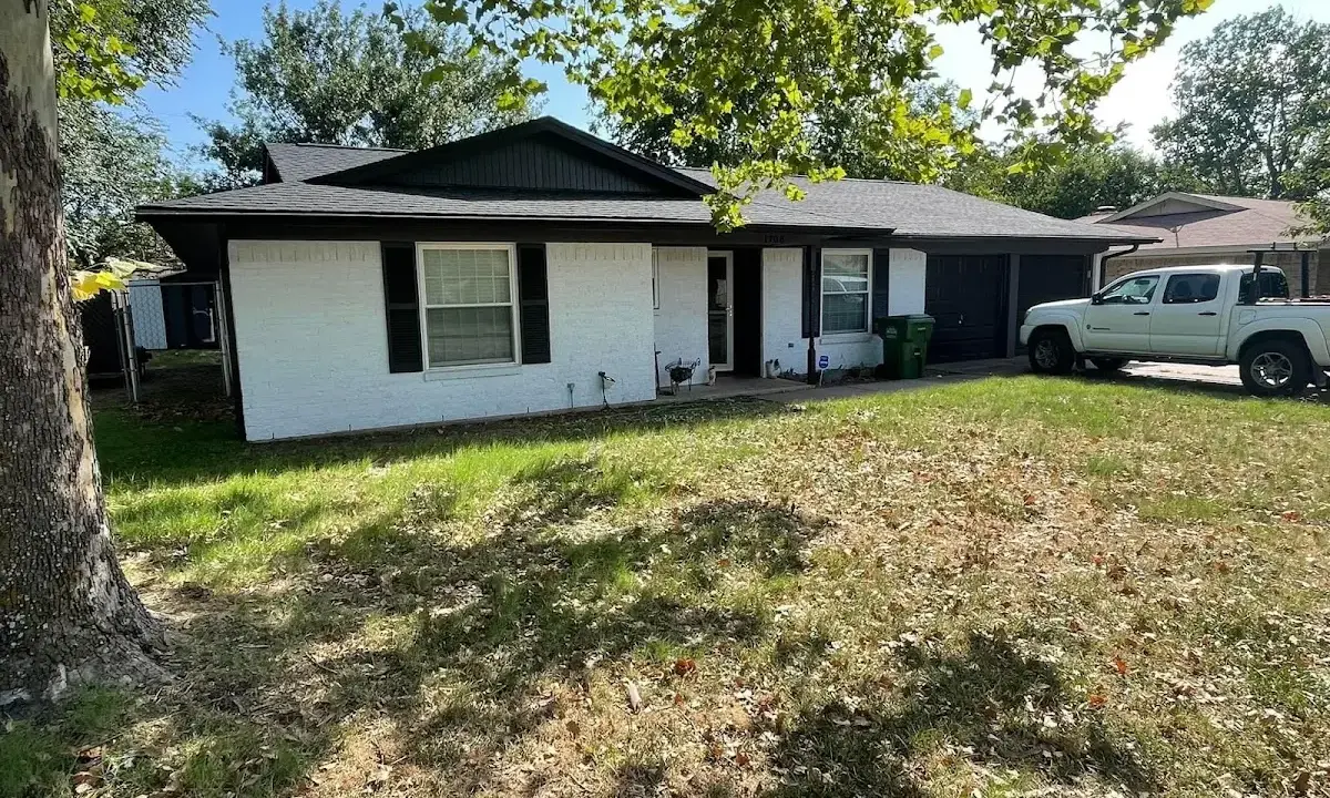 Professional roofing crew working on a residential roof in Little Egg Harbor